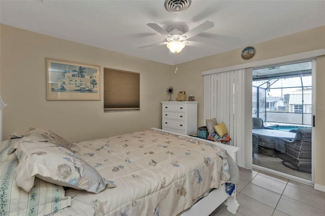 tiled bedroom with access to outside, a textured ceiling, and ceiling fan