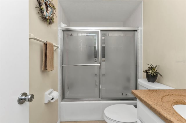 full bathroom with vanity, combined bath / shower with glass door, and toilet