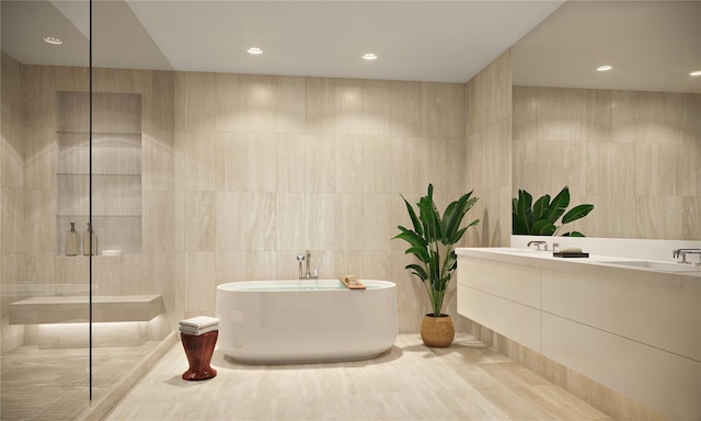 bathroom featuring vanity, separate shower and tub, and tile walls