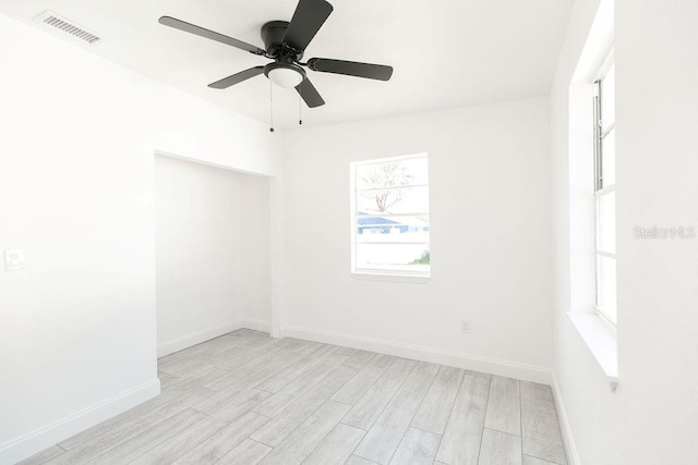 spare room featuring ceiling fan and light hardwood / wood-style floors