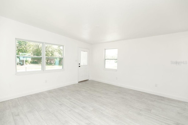 spare room featuring light hardwood / wood-style floors