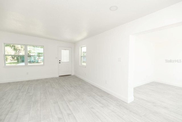 spare room featuring light hardwood / wood-style flooring