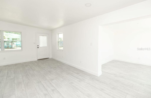 spare room featuring light wood-type flooring