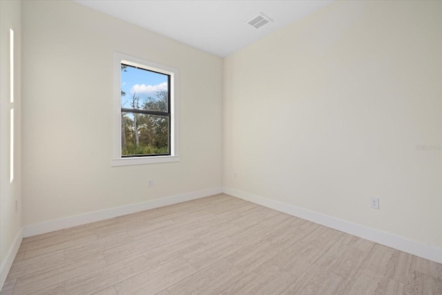 unfurnished room featuring light wood-type flooring