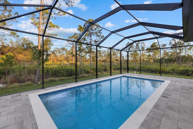 view of pool featuring a lanai and a patio area