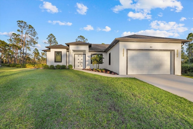 view of front of house with a garage and a front yard