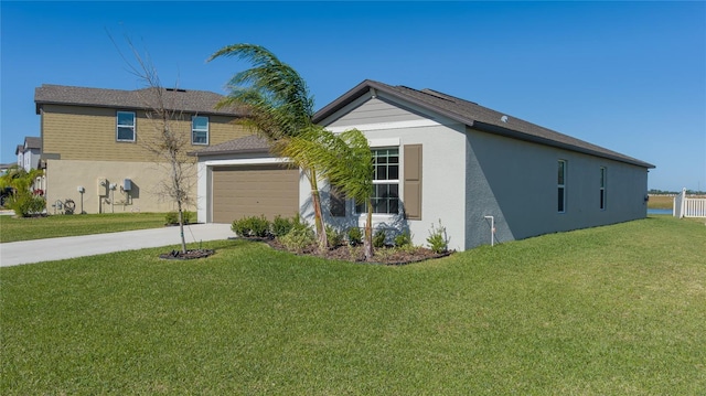 view of front facade with a garage and a front yard