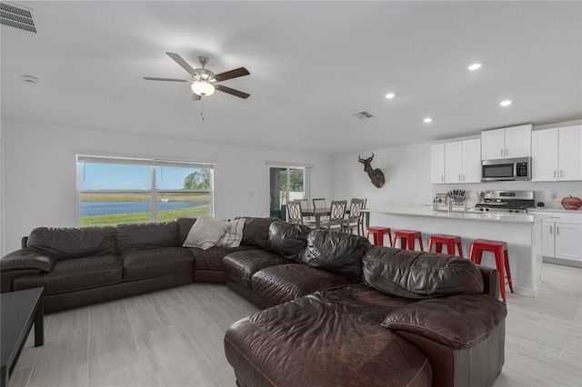 living room with ceiling fan