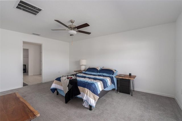 bedroom with ceiling fan and light colored carpet