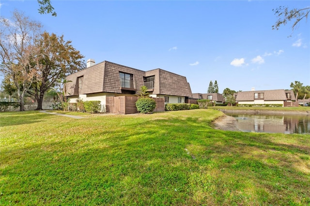 exterior space with a water view