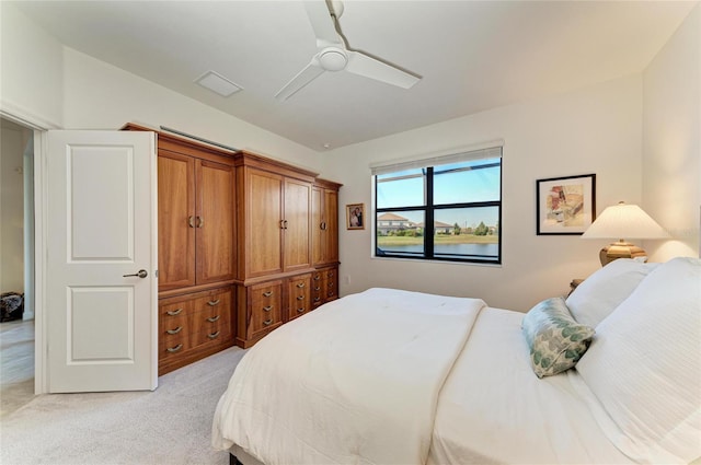 carpeted bedroom with ceiling fan