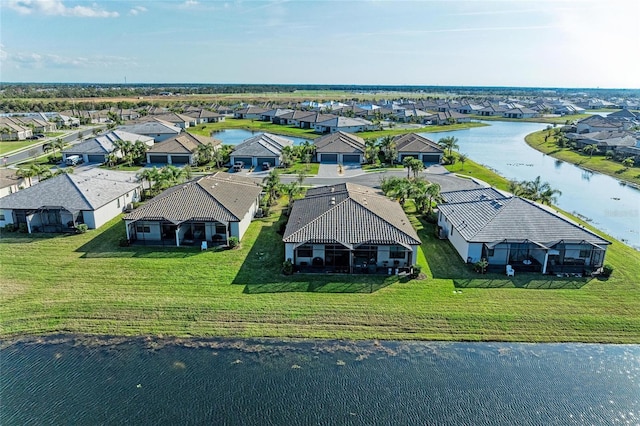 drone / aerial view with a water view