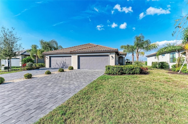 view of front of property featuring a garage and a front yard