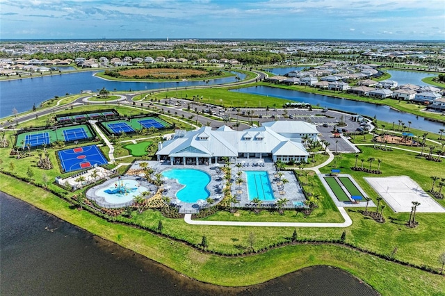 birds eye view of property with a water view