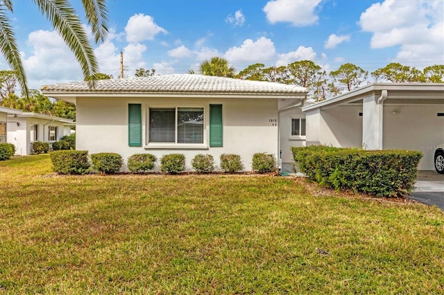 single story home featuring a front lawn