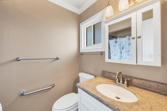 bathroom with vanity, ornamental molding, and toilet