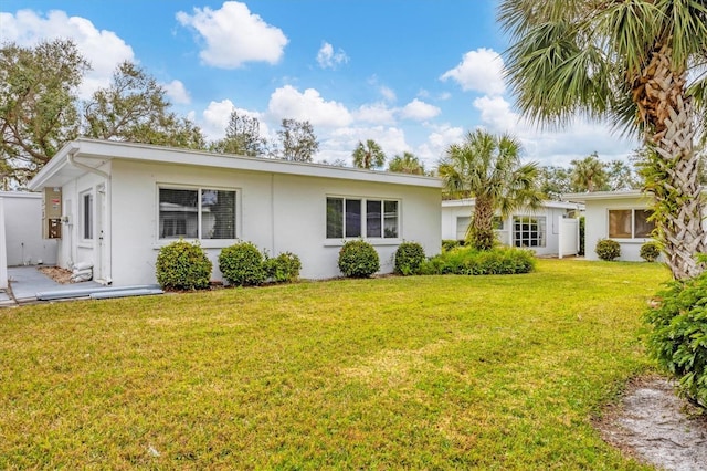 view of front of home featuring a front lawn