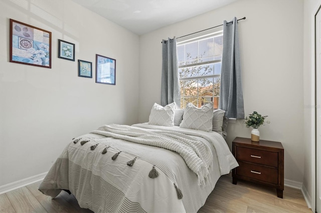 bedroom with light wood-type flooring