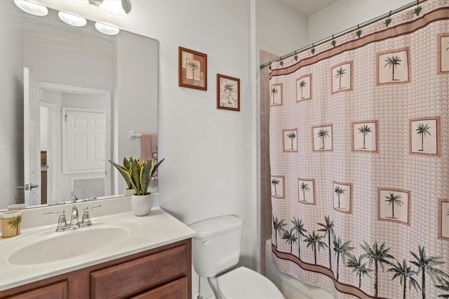 bathroom featuring vanity, toilet, and walk in shower