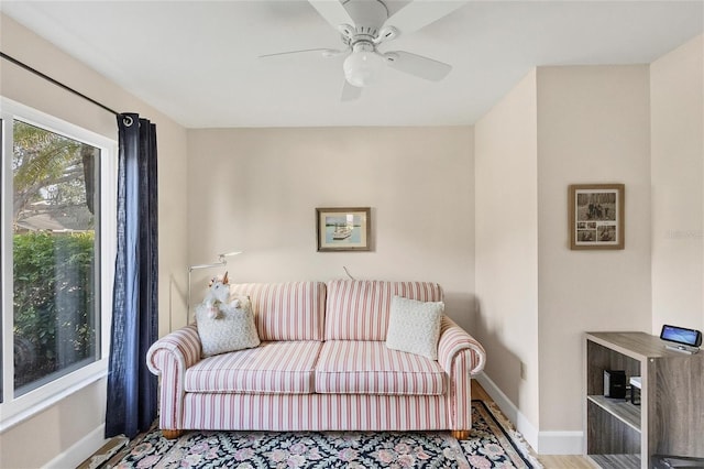 living room featuring hardwood / wood-style flooring and ceiling fan