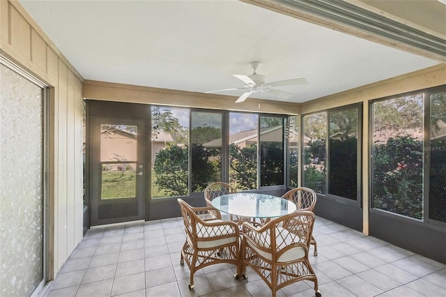 sunroom / solarium featuring ceiling fan