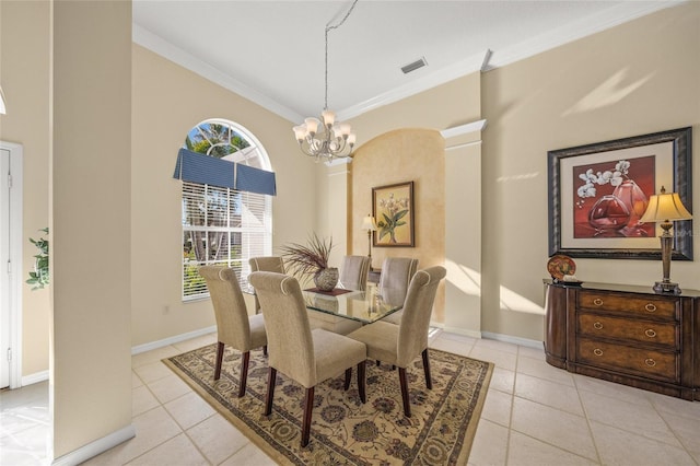 tiled dining room with crown molding and a chandelier