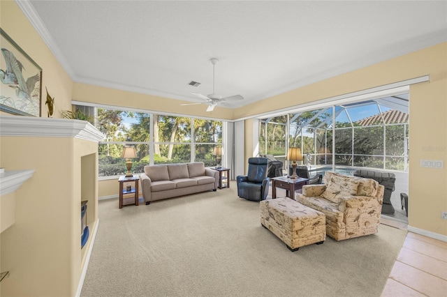 sunroom / solarium featuring ceiling fan