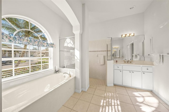 bathroom with vanity, tile patterned floors, and independent shower and bath