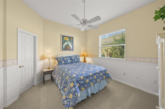 bedroom with light carpet and ceiling fan