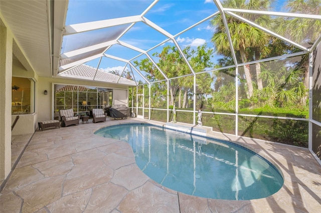 view of pool featuring a lanai and a patio area