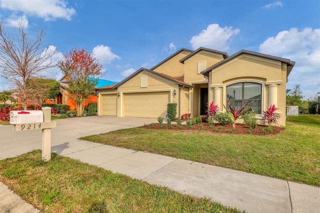 view of front of property featuring a garage and a front lawn