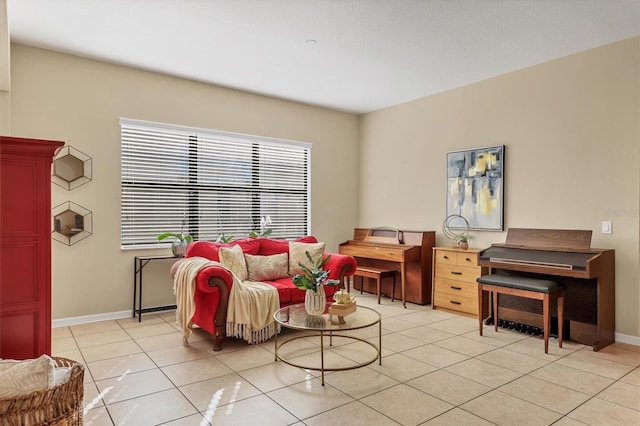 living room with light tile patterned floors and baseboards