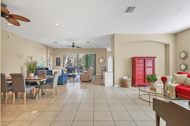 dining area with visible vents, a ceiling fan, recessed lighting, light tile patterned floors, and baseboards