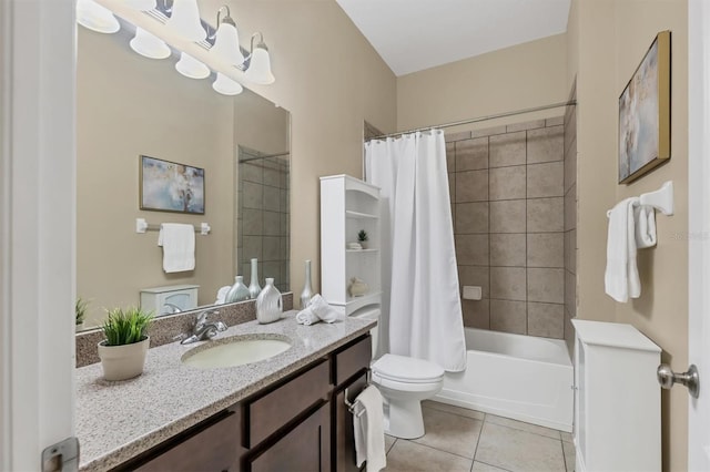 bathroom featuring tile patterned floors, shower / bath combo with shower curtain, toilet, and vanity