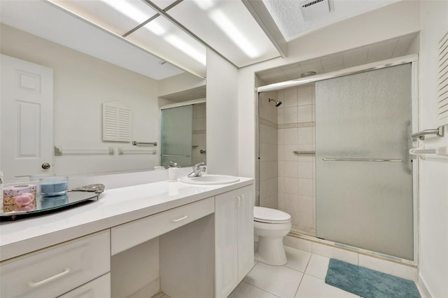 bathroom with vanity, an enclosed shower, and toilet