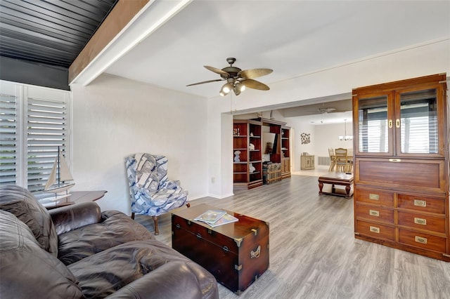 living room featuring ceiling fan and light wood-type flooring