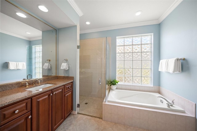 bathroom featuring vanity, tile patterned flooring, ornamental molding, and shower with separate bathtub