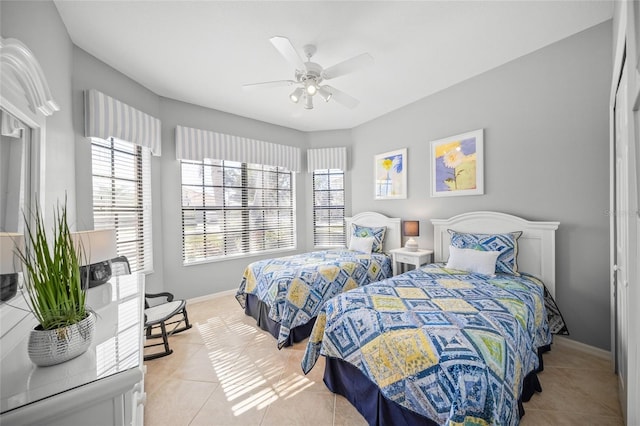 bedroom featuring ceiling fan and light tile patterned flooring