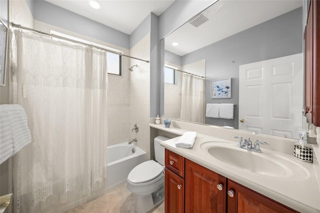 full bathroom featuring tile patterned floors, vanity, toilet, and shower / tub combo