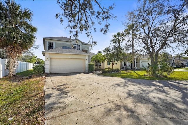 view of front of house with a garage and a front yard