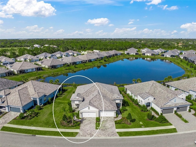 birds eye view of property with a water view