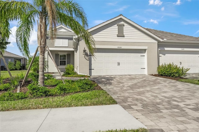 ranch-style house featuring a garage