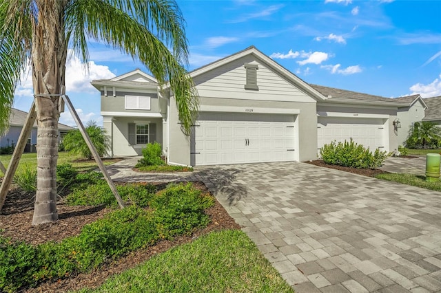 ranch-style home featuring a garage