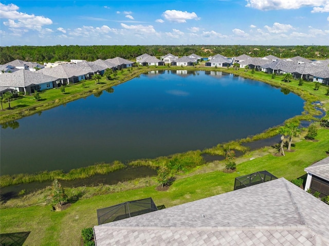 birds eye view of property with a water view