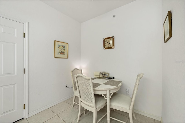 dining space featuring light tile patterned floors