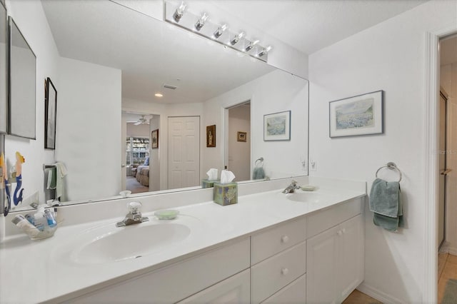 bathroom featuring vanity and ceiling fan