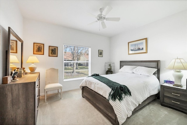 bedroom with light carpet and ceiling fan