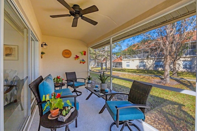 sunroom with ceiling fan