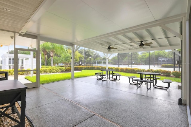 view of community with a patio and a lawn