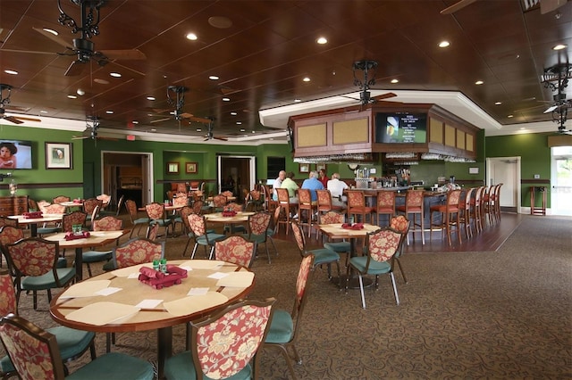 dining room featuring ornamental molding and ceiling fan